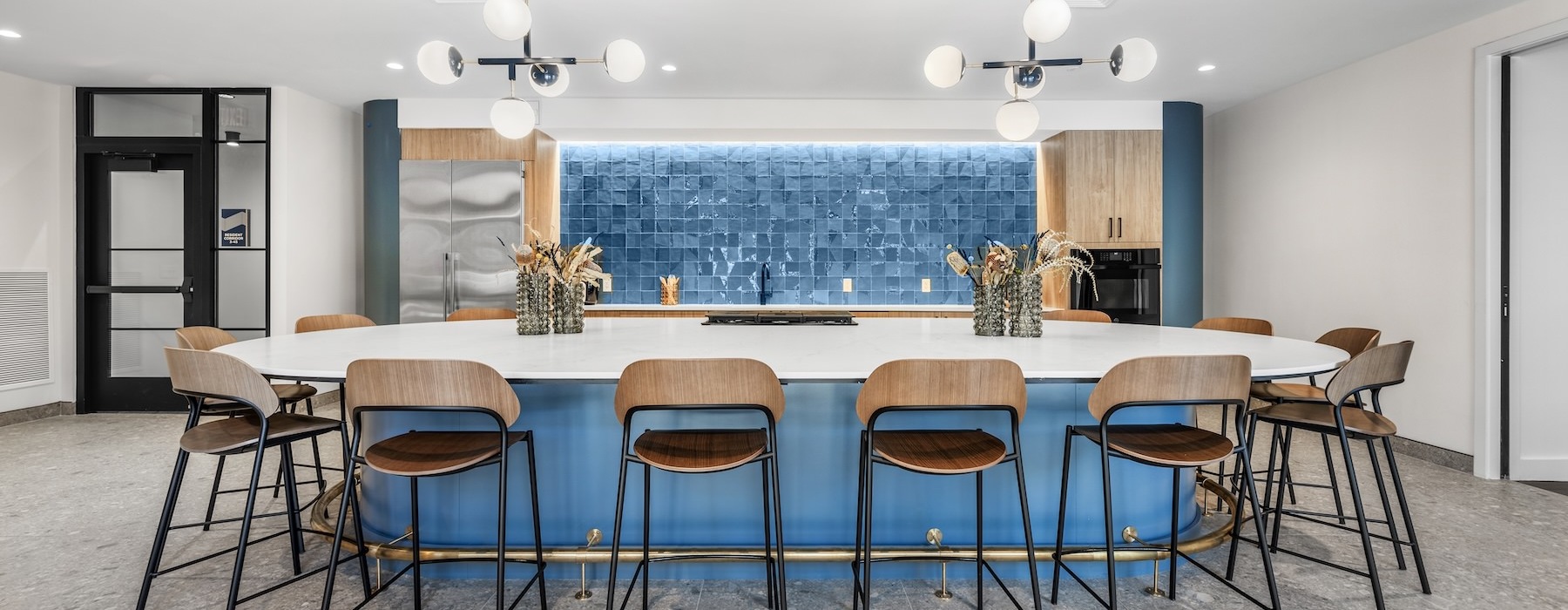 a community kitchen with a table and chairs
